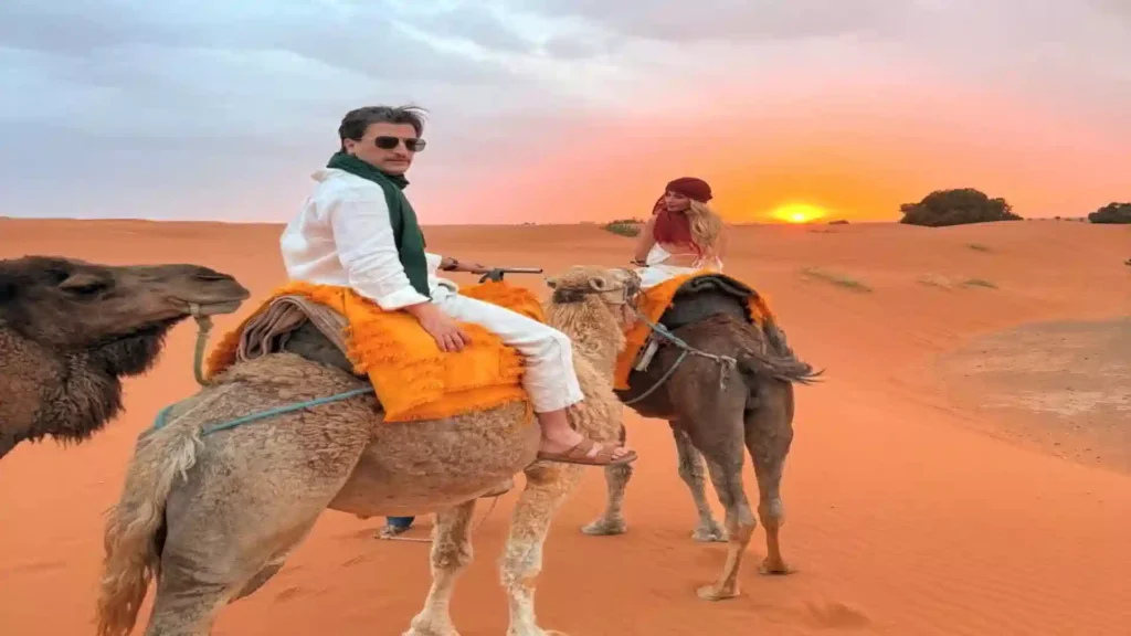 Camel trek at sunset Erg Chebbi Merzouga — Morocco tours from UK with Over Morocco Tours 2026