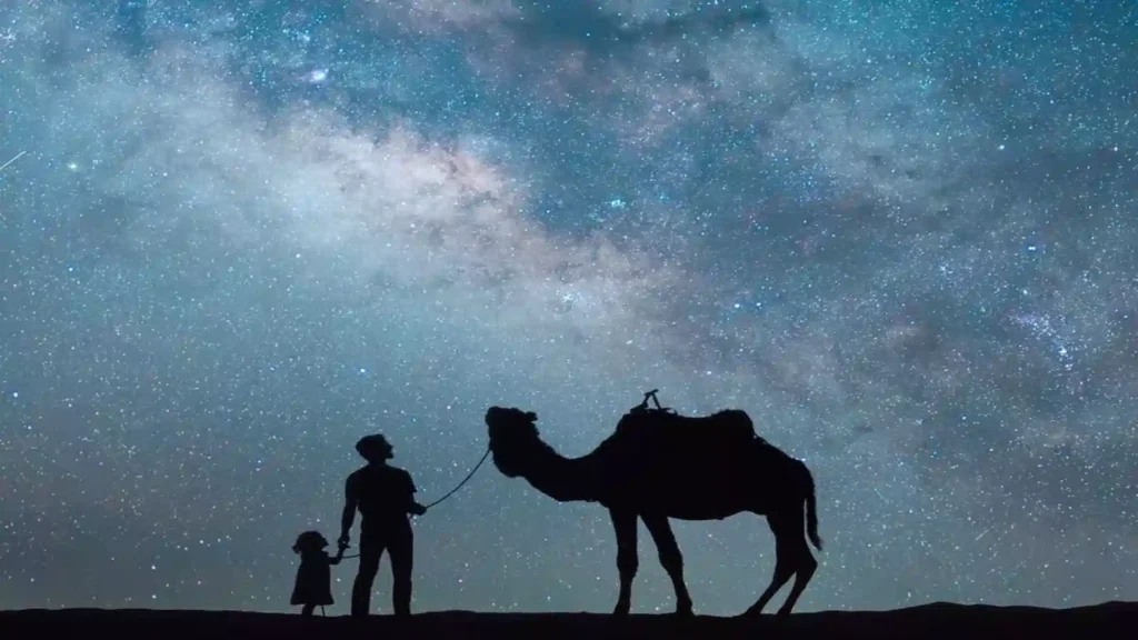 Stargazing in Morocco — Milky Way above Erg Chebbi glamping camp tents at 2am, Merzouga Sahara Desert, Over Morocco Tours 2026
