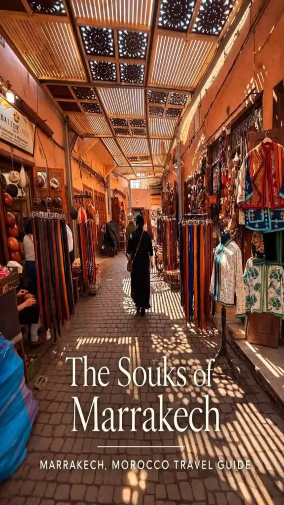 Narrow covered alleyway in the Medina lined with leather goods, belts, and jackets for a guide on the 7 best souks in Marrakech.