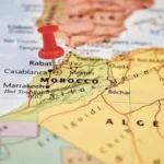 A red pushpin placed directly over Rabat to highlight where is Morocco in Africa on a physical map.