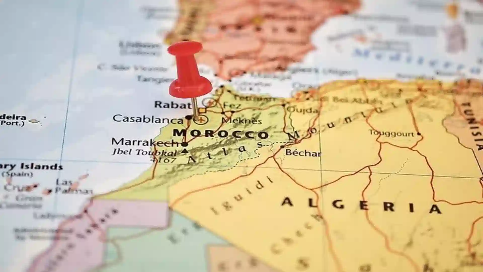 A red pushpin placed directly over Rabat to highlight where is Morocco in Africa on a physical map.