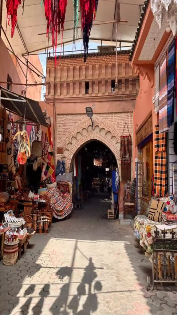 Covered brick archway in a Moroccan old town street illustrating what does Medina mean in urban design.