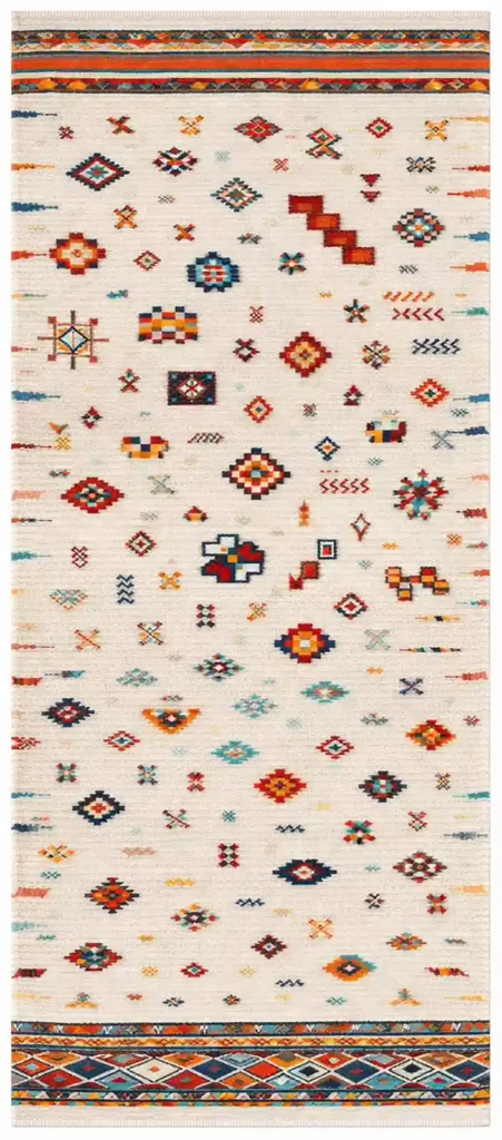 A full-length view of a ivory Moroccan rug carpet featuring colorful hand-woven Berber geometric shapes and tribal symbols.